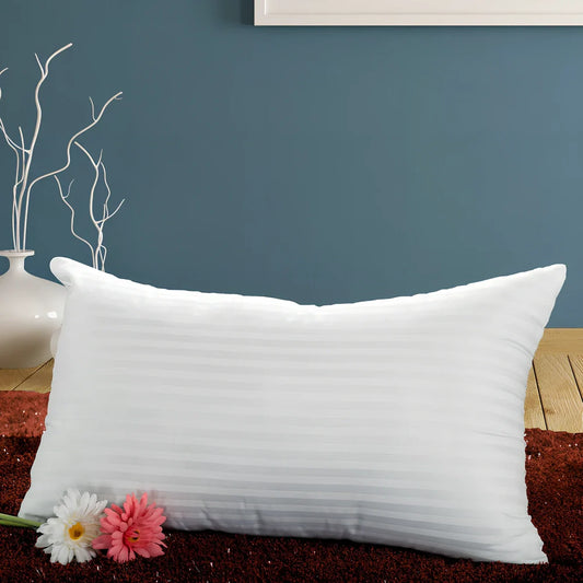 White square healthcare pillow measuring 40x70cm with polyester fibre filling