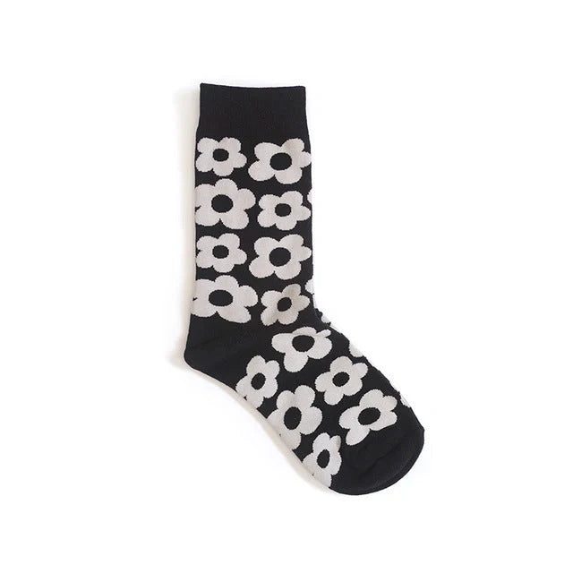 Cozy cotton socks featuring a playful cartoon flower pattern, designed for breathability and comfort.