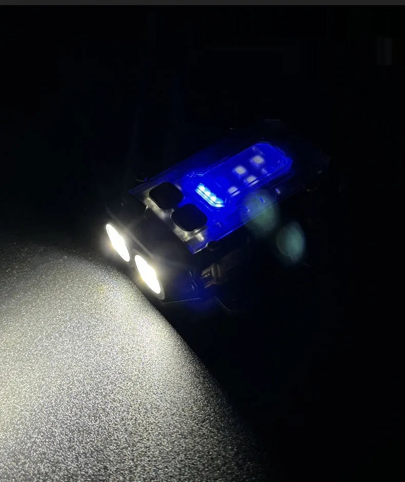 Compact black rechargeable tactical flashlight with USB charging cable for backpack mounting.