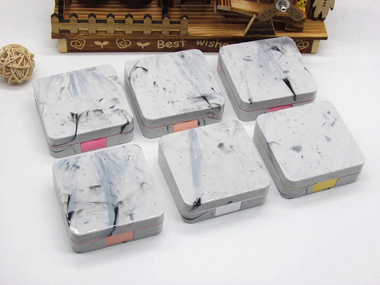Square contact lenses case with marble surface and mirror, includes lens care accessories