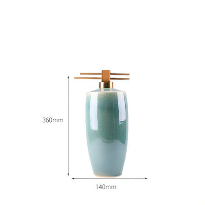 Handmade ceramic ornaments in graduated sizes with emerald green and golden sunlight glazes