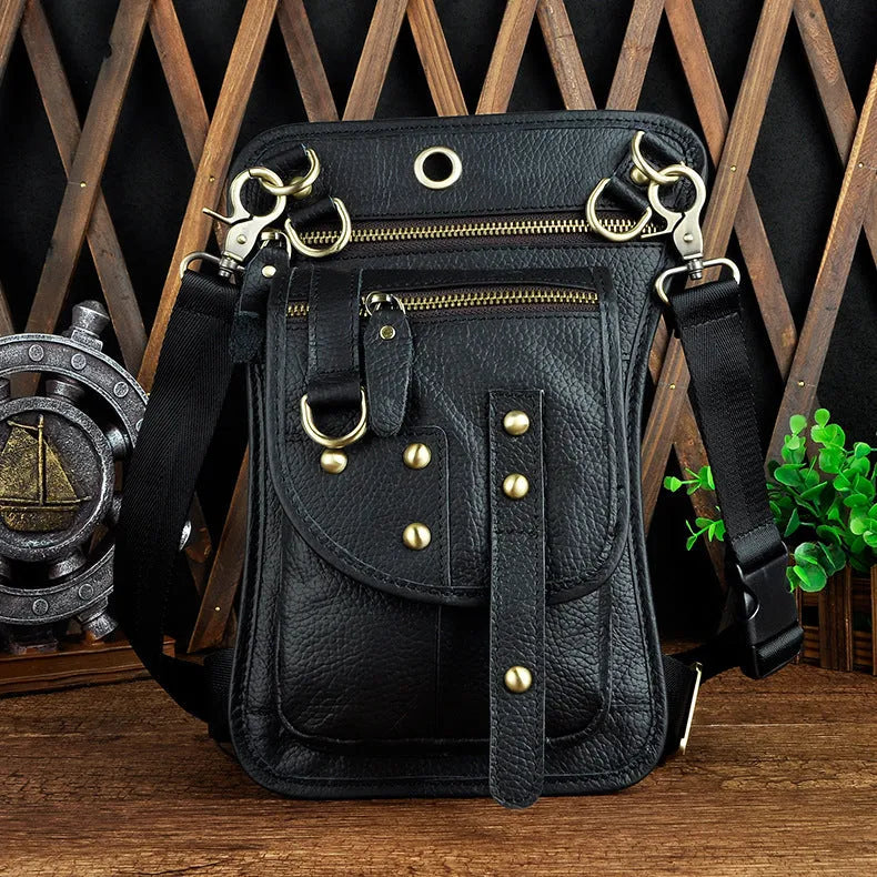 Men's black punk fanny pack with cowhide leather, zipper closure, and internal phone and ID compartments.