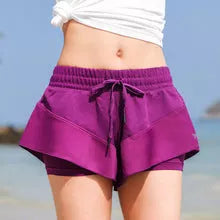 Quick-drying nylon athletic shorts in purple, available in sizes S to XL