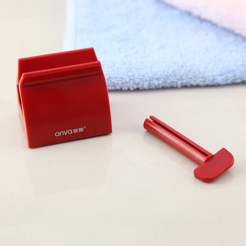 Versatile toothpaste dispenser made of durable ABS plastic for effortless product extrusion and bathroom organization
