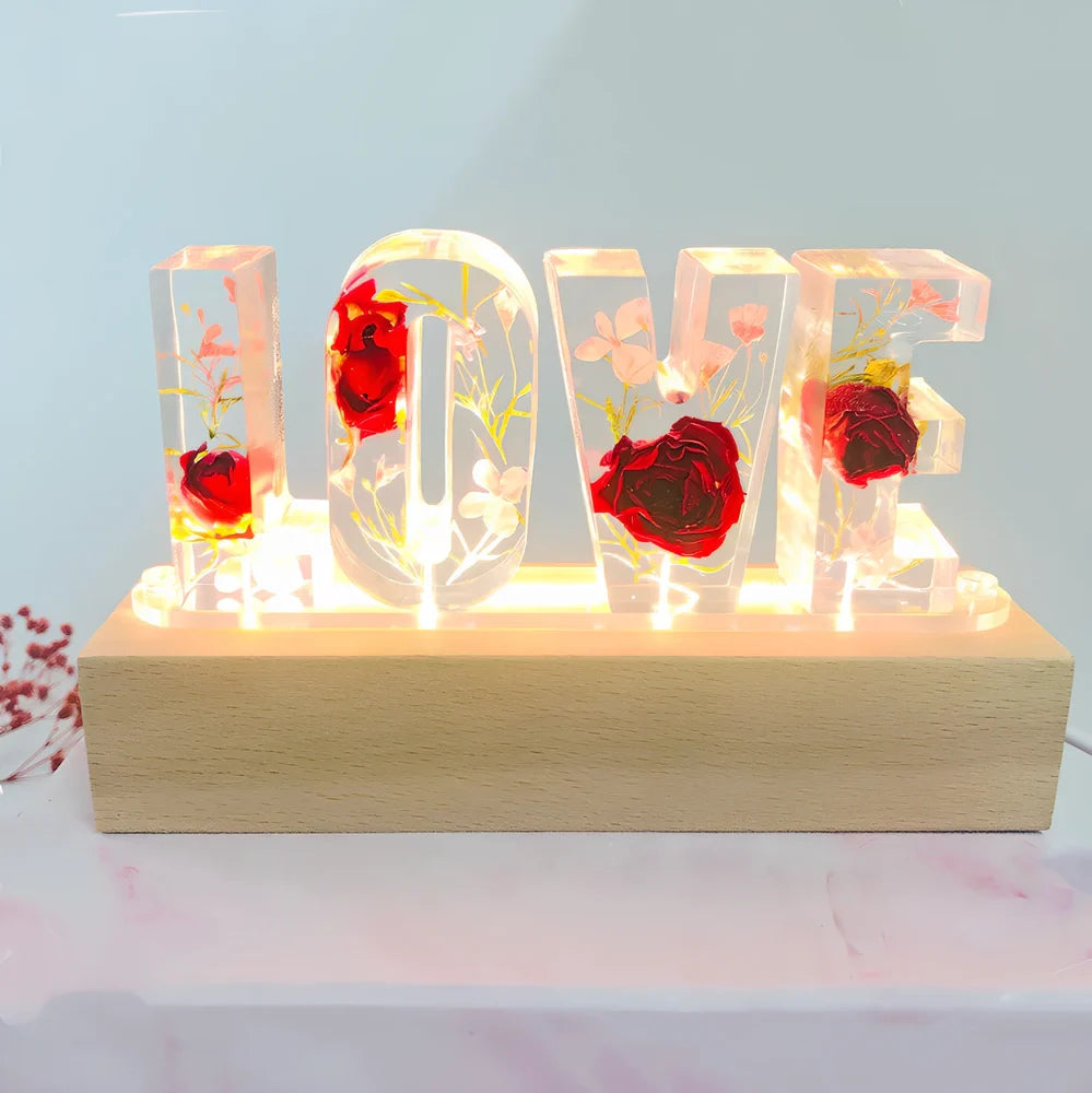 Wooden LOVE letter table lamp with dried flowers and warm LED light for bedroom use