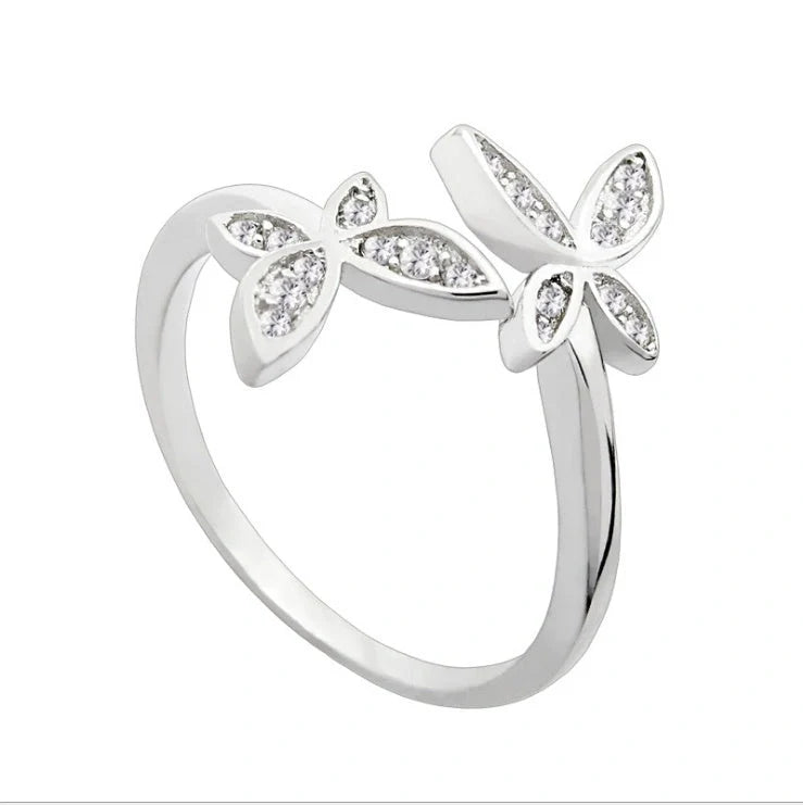 Adjustable sterling silver ring with intricate butterfly design, ideal for everyday wear or special occasions.
