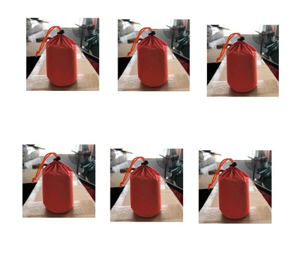 Orange First-aid Tent Insulation Mat reflecting sunlight, ready for emergency use