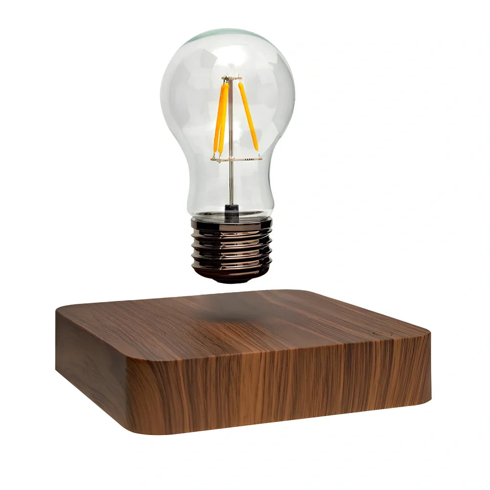 Self-rotating maglev LED bulb levitating above circular base with warm yellow illumination