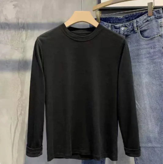 Men's black and white striped sweater in silk and linen blend showing temperature-regulating fabric texture