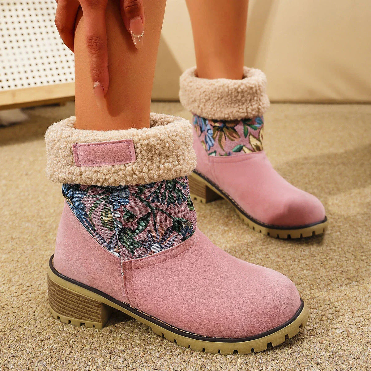 Floral embroidered snow boots in off-white, black, and pink colors with thick square heels and round toe shape