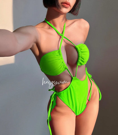 Women's solid colour one-piece swimsuit with drawstring fastening in nylon fabric.
