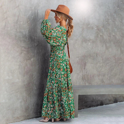 A green halter dress with a vibrant printed pattern and lantern sleeves.