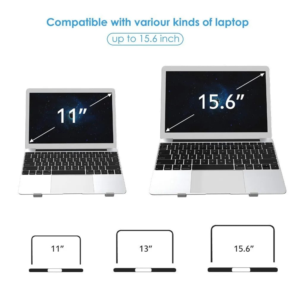 Black and silver aluminum laptop stand measuring 26cm wide on a wooden desk.