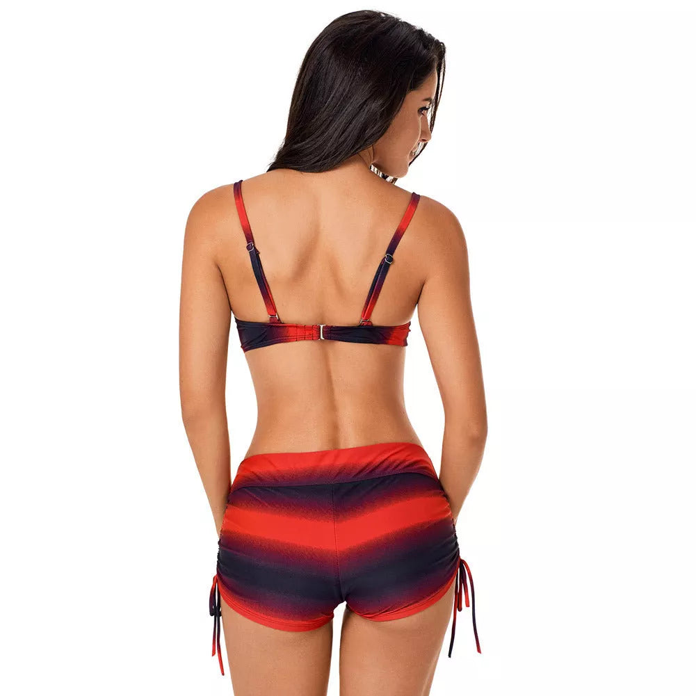 Plus size swimsuit with adjustable fit and gradient pattern in red and blue