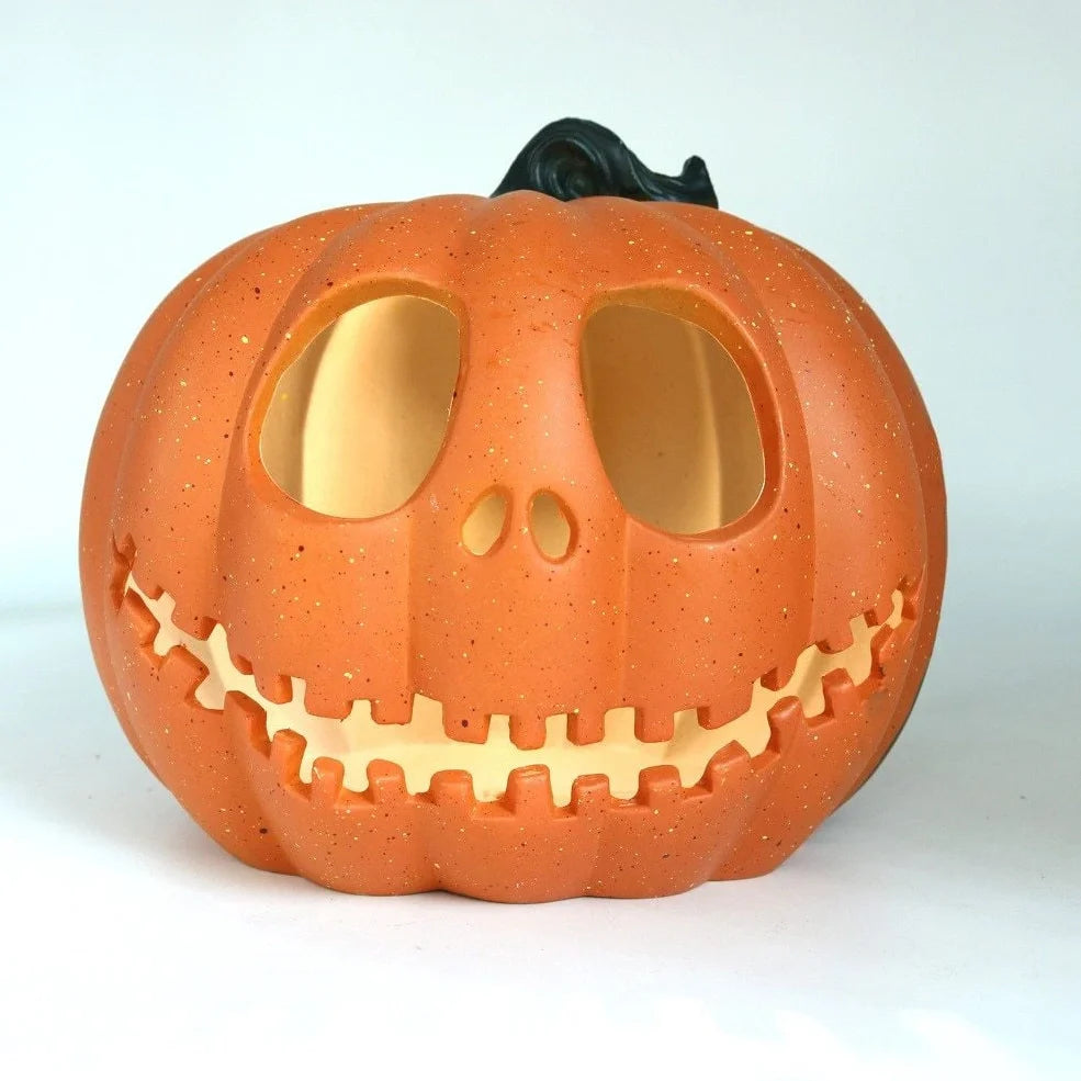 Halloween pumpkin lantern with hollow-out skull design measuring 23 by 19 centimetres