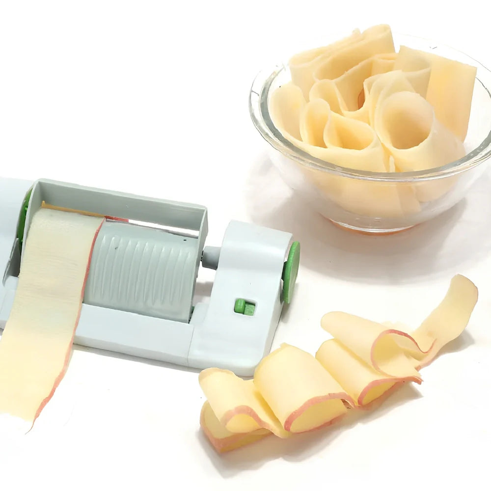Green and white kitchen fruit slicer with 8mm blades on 22.5cm frame