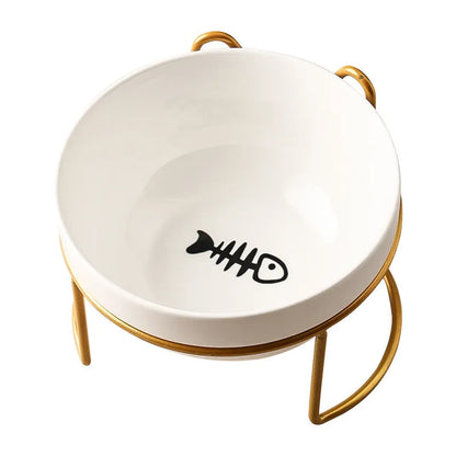 White ceramic pet bowl with cat paw design on a black iron frame raised feeder.