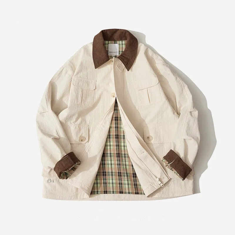 Green and apricot unisex polyester casual jacket with side seam pockets on a hanger
