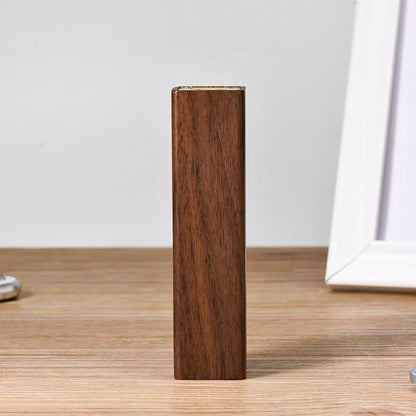 Brown walnut wood portable power bank with 2000mAh capacity showing compact rectangular design