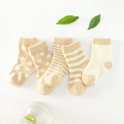 A group of colorful cotton tube socks in various sizes and patterns, designed for children's comfort and style.
