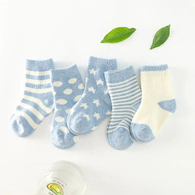 A group of colorful cotton tube socks in various sizes and patterns, designed for children's comfort and style.
