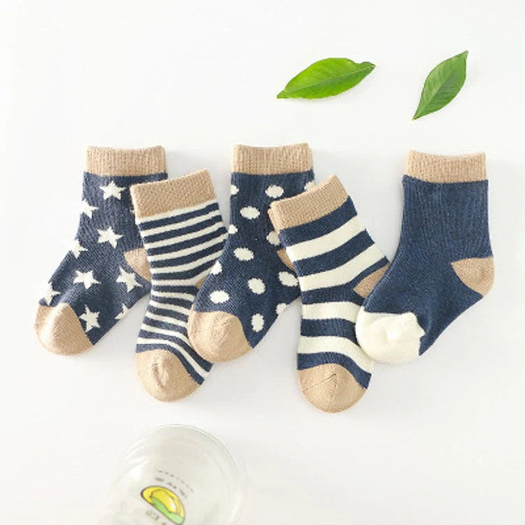 A group of colorful cotton tube socks in various sizes and patterns, designed for children's comfort and style.