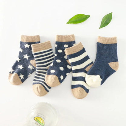 A group of colorful cotton tube socks in various sizes and patterns, designed for children's comfort and style.