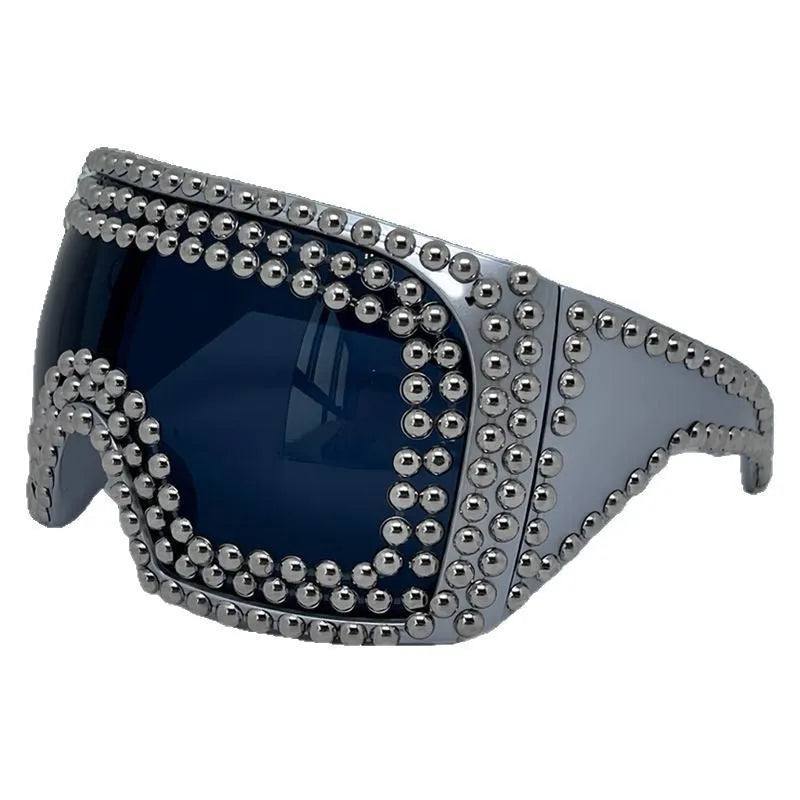 Square punk sunglasses with large rim and rivet detailing in gold colour
