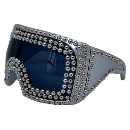 Square punk sunglasses with large rim and rivet detailing in gold colour