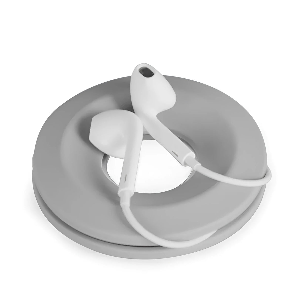 Silicone donut cord reel with magnet for organising mobile phone and headphone cables in light grey colour