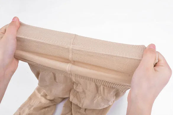 Women's seamless high-waist shapewear shorts in black and nude colours showing tummy control design