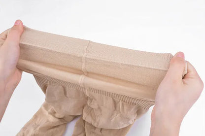 Women's seamless high-waist shapewear shorts in black and nude colours showing tummy control design