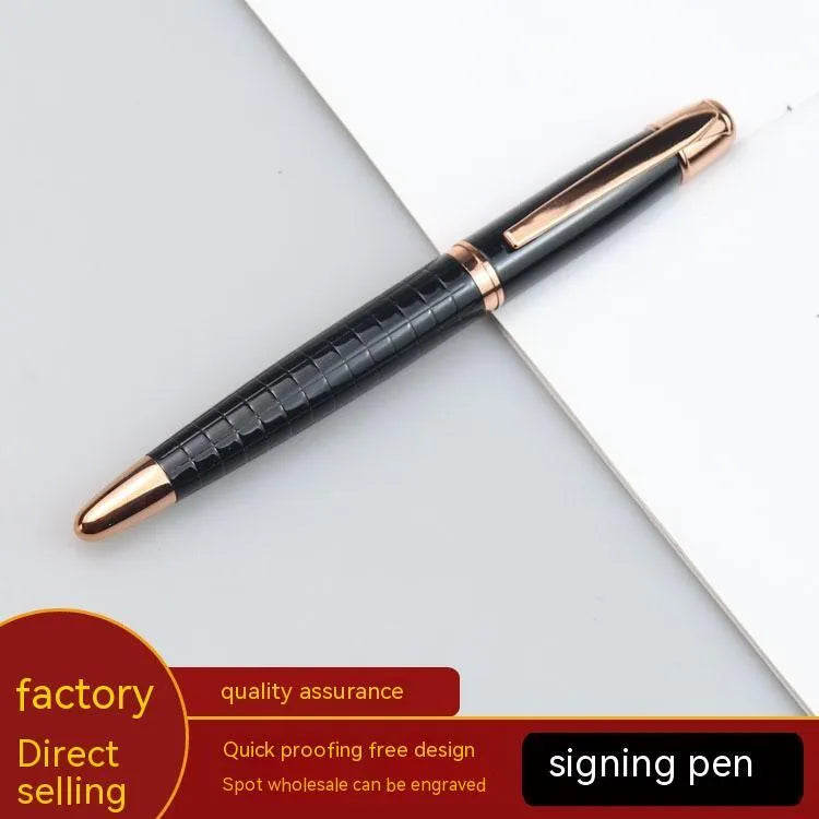 Gun grey metal rollerball pen with a metal barrel on a flat surface.