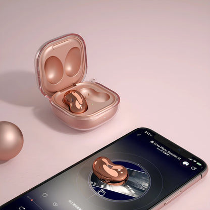 Transparent clamshell-style Bluetooth earphone case in translucent black, gold, purple, and clear colours.