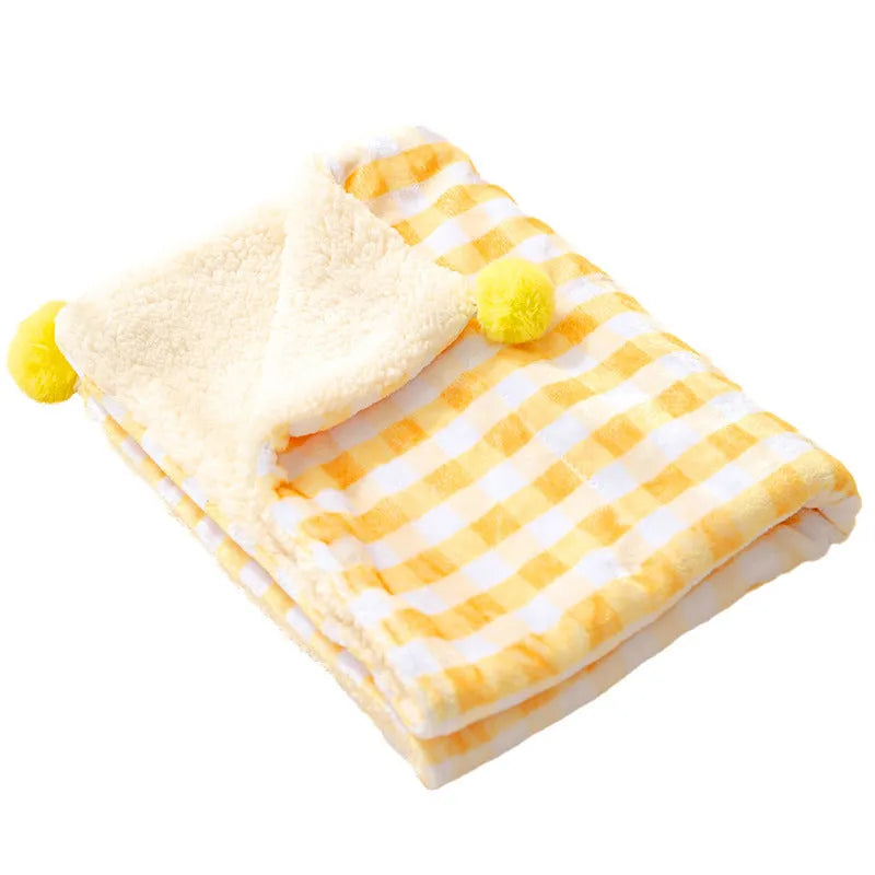 Blue coral fleece pet blanket shown in a Large size (70x50cm) on a wooden floor.