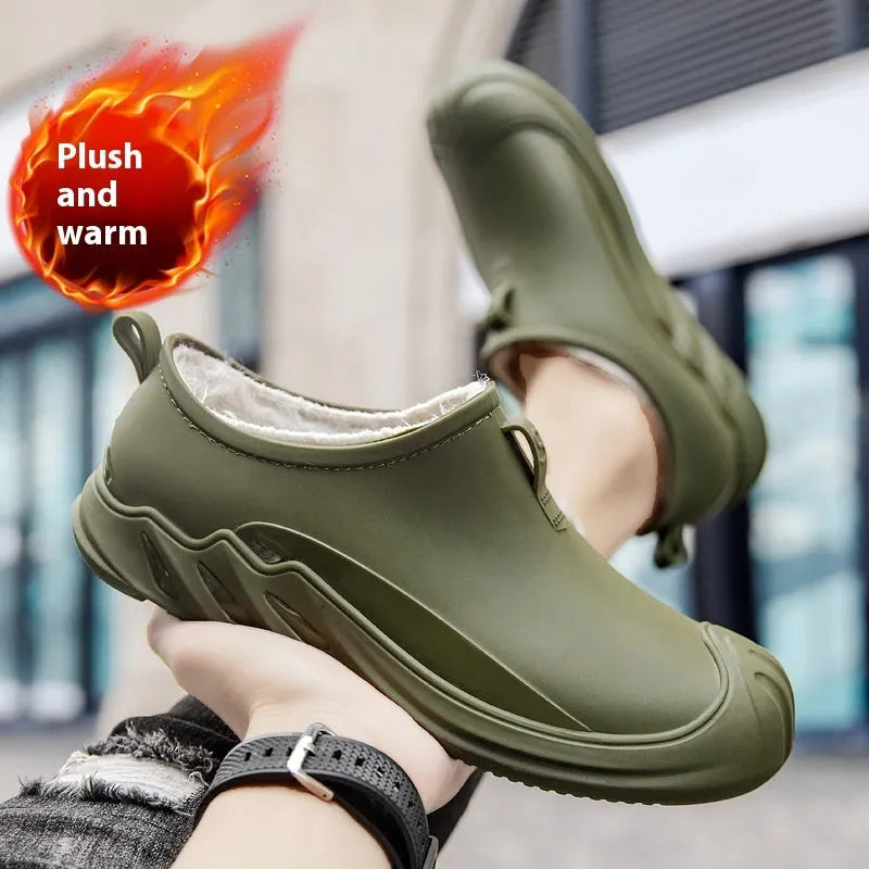Men's short black plastic rain boots showing casual design and waterproof construction