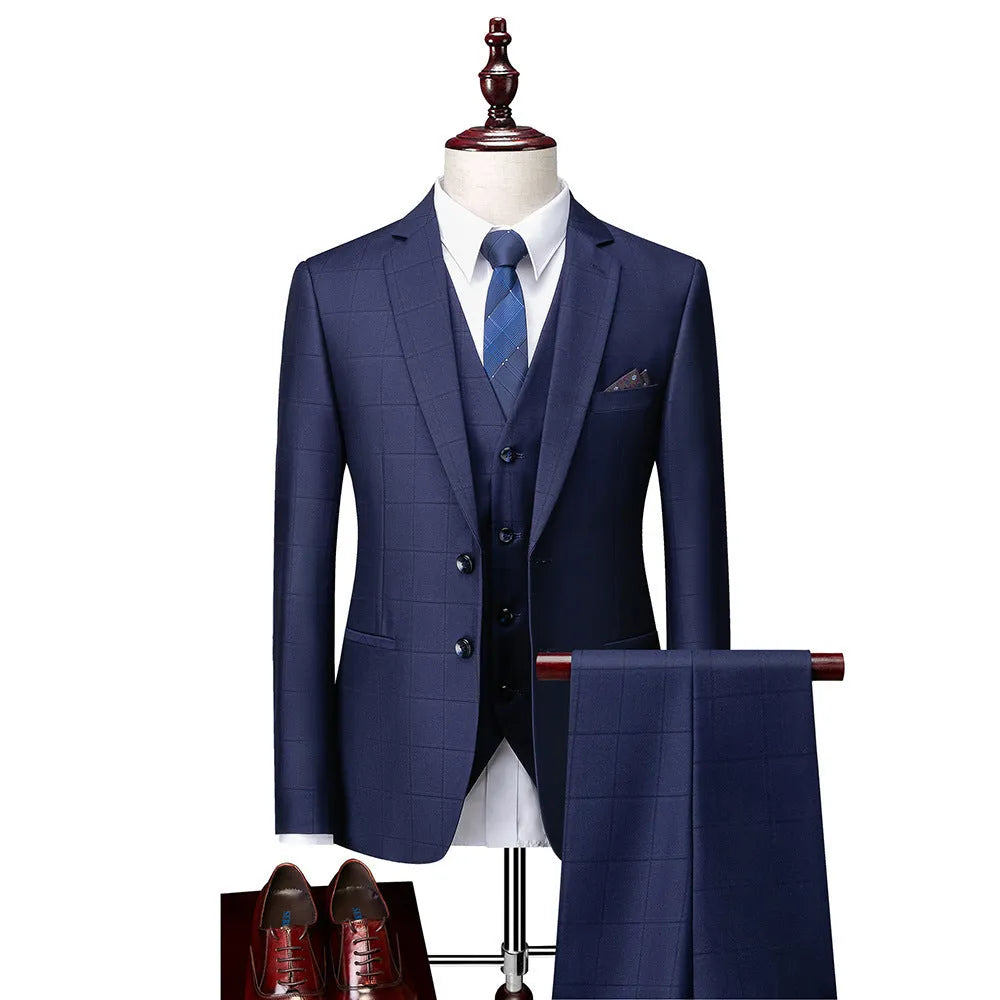 Men's navy blue slim fit three-piece suit with waistcoat on a hanger