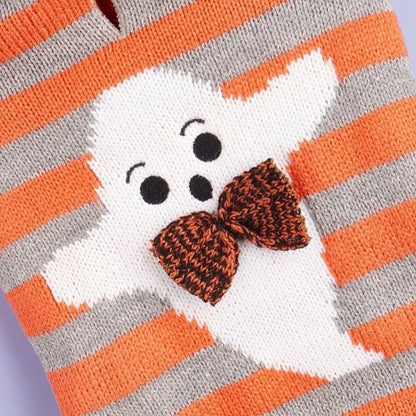 Orange Halloween pet sweater with knitted stripes, fur ball accents, and hood for cats or dogs