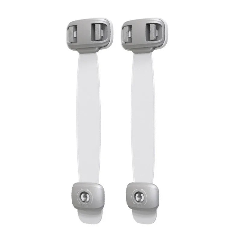 Grey adjustable child safety lock strap with 3M adhesive, shown securing a cabinet door.