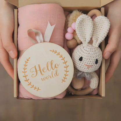 Six wooden animal bath toys floating in water with blue, brown and peach colour options