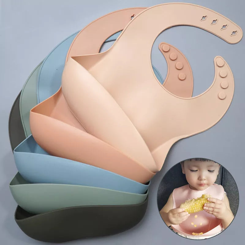 Soft waterproof silicone baby bib with food catcher in various colors