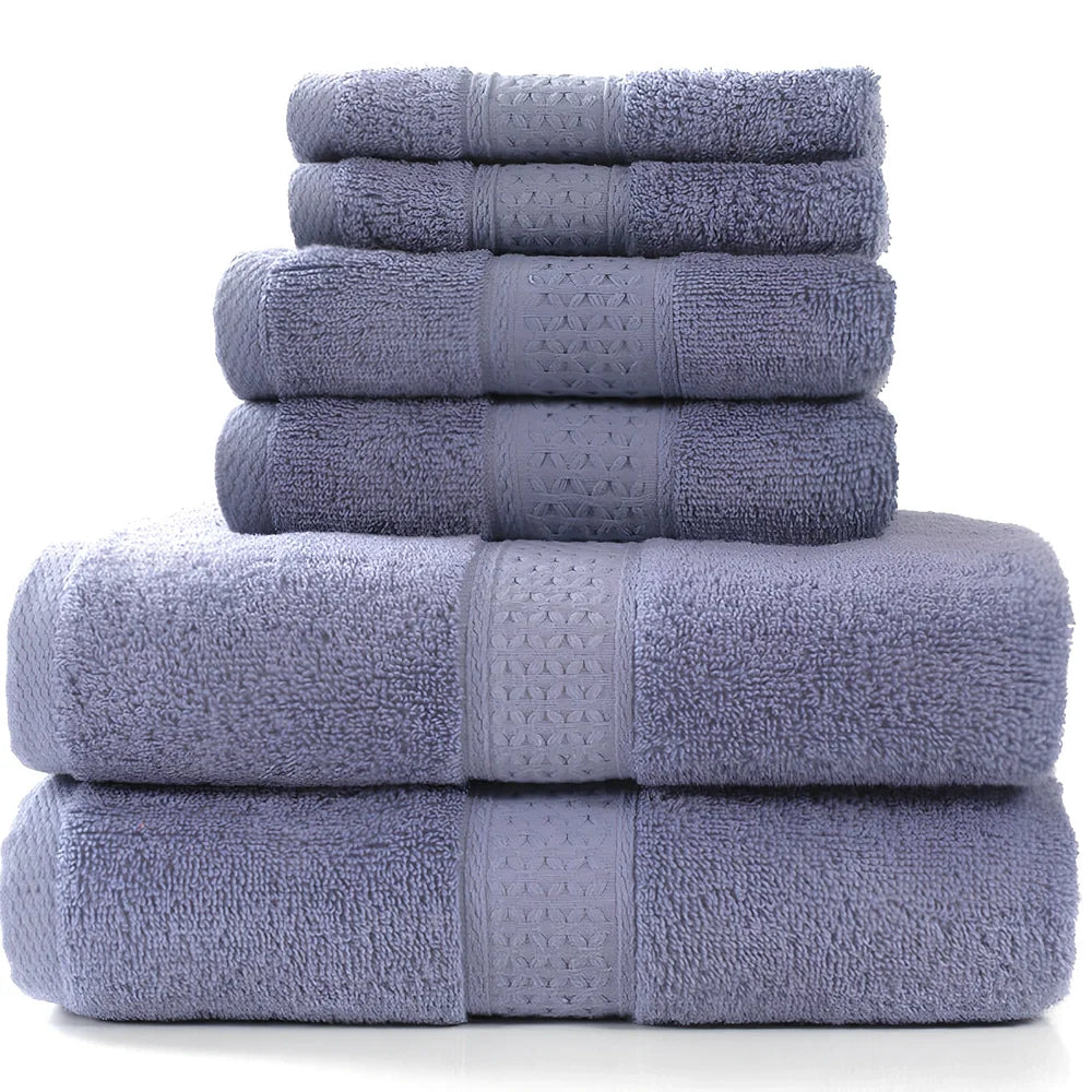 Cotton towel set showing bath towel, hand towel, and face cloth in coordinated sizes