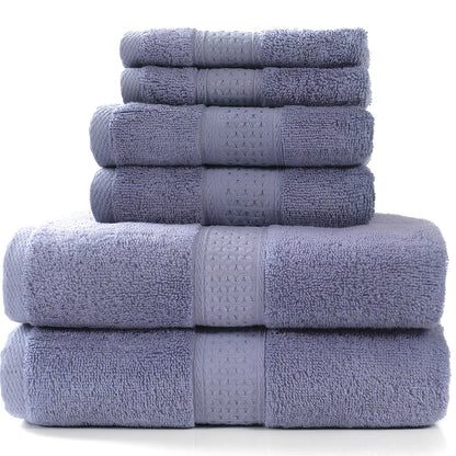 Cotton towel set showing bath towel, hand towel, and face cloth in coordinated sizes