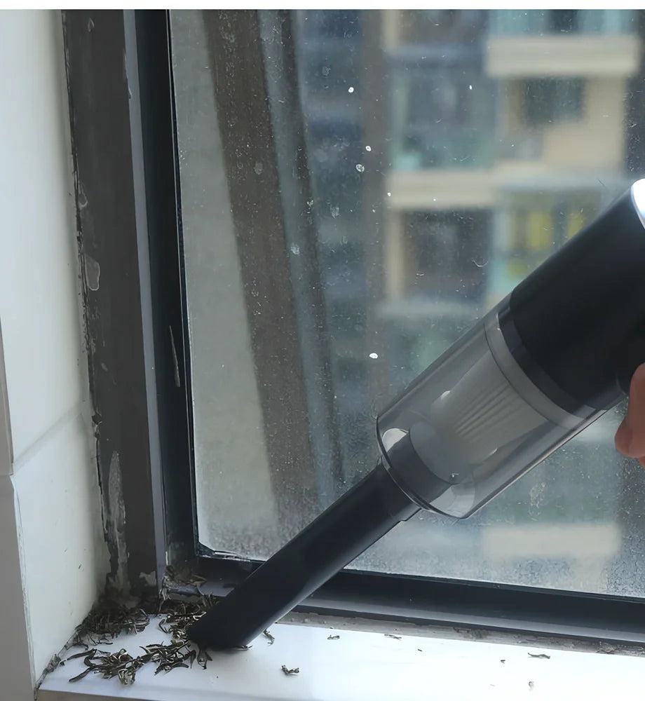 Black cordless car vacuum with suction head and brush attachment, 16.5cm size