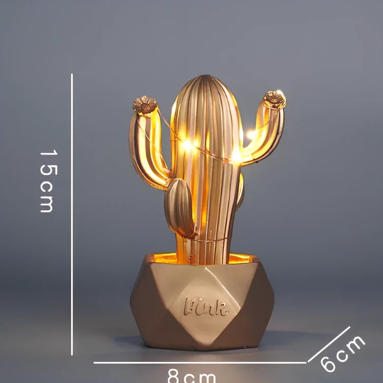 Cactus-shaped resin night light in gold finish measuring 15cm tall with warm LED glow