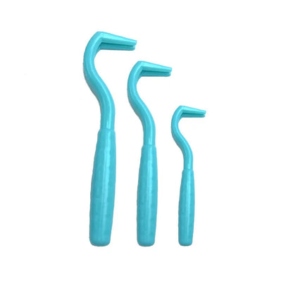 Set of three coloured tick hook removal tools for dogs on a white background.