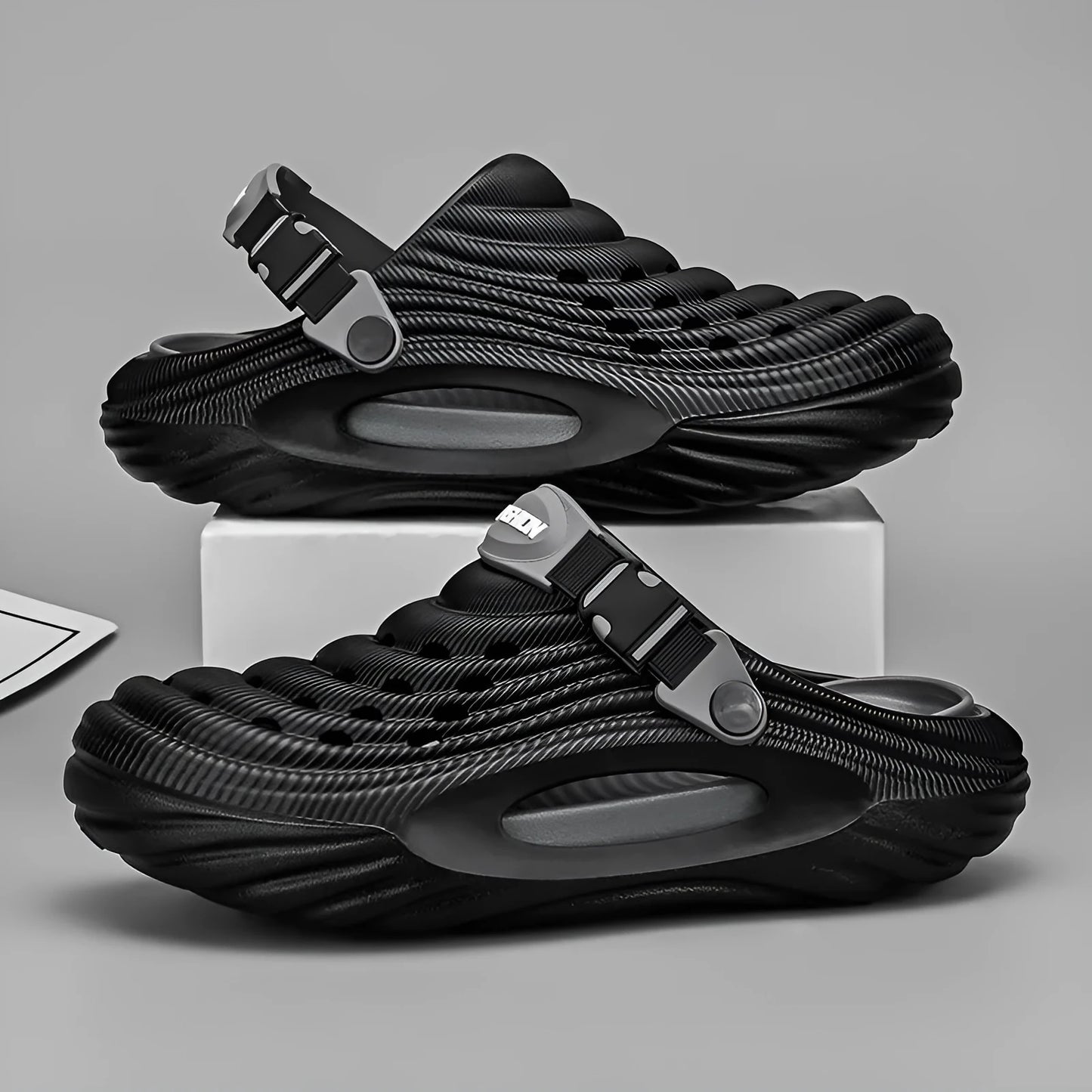 Men's solid colour casual platform slippers in EVA with a hollow-out design.