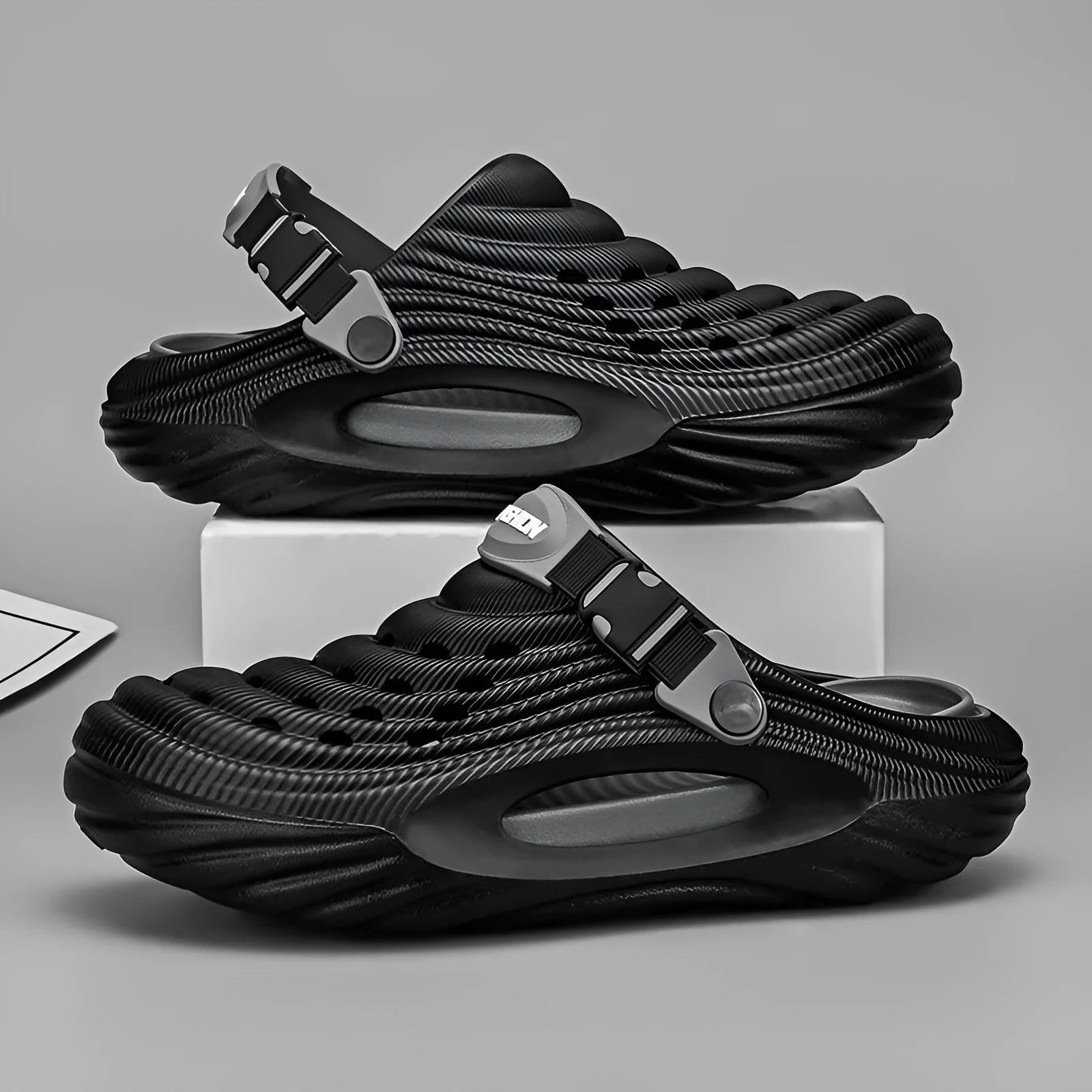 Men's solid colour casual platform slippers in EVA with a hollow-out design.