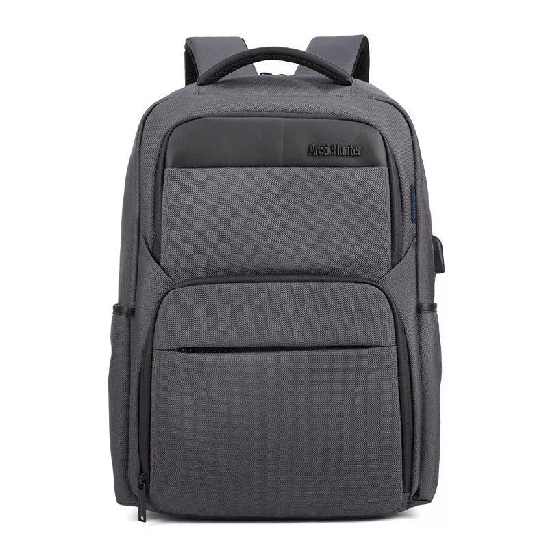 Men's USB charging anti-theft backpack in grey, blue, or black with multiple compartments