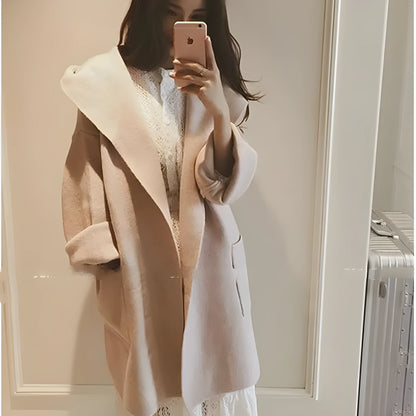 Plus size woman wearing a grey thin cotton coat with lace details, loose fit, long sleeves.